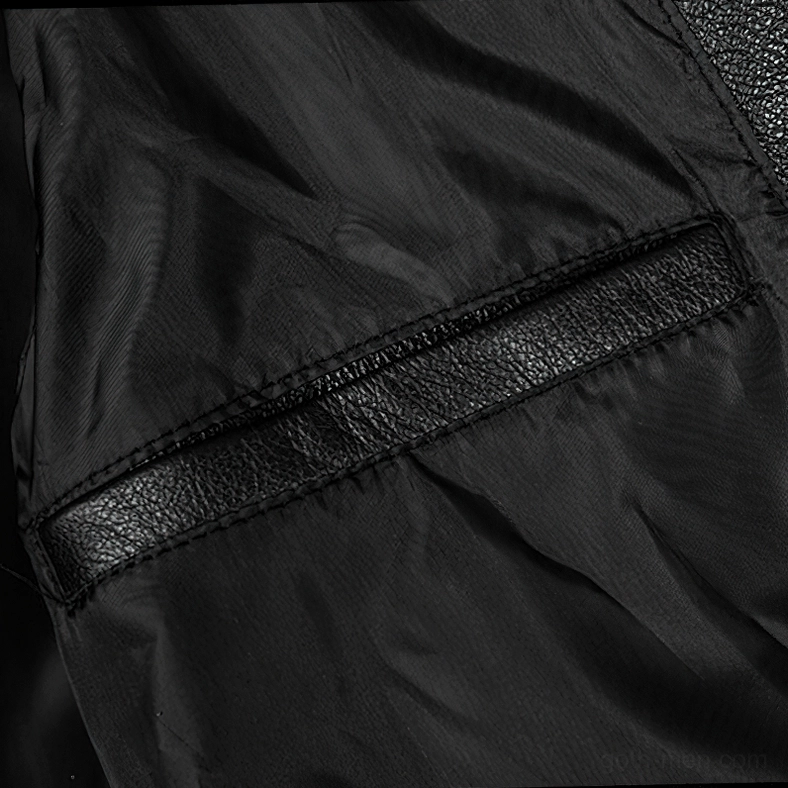 Gothic leather motorcycle jacket detail photograph showing zipper closure and reinforced stitching quality