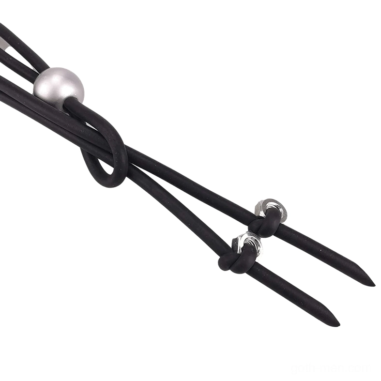 Macro close-up of gothic lariat necklace showing black rubber cord, silver bead, and industrial screw-style metal hardware