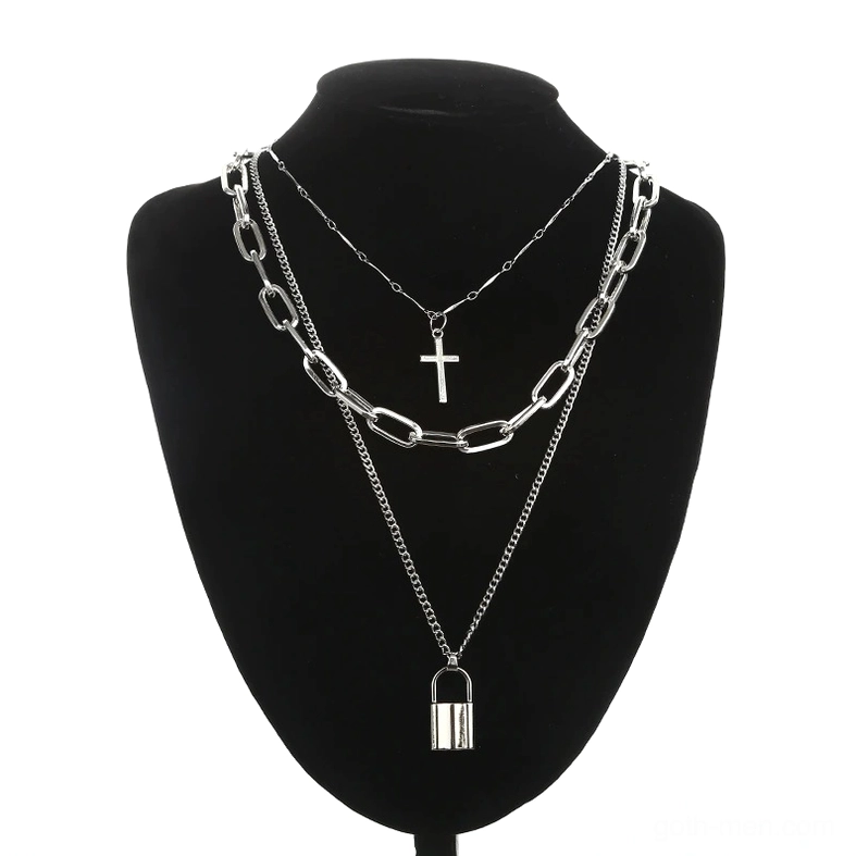 Three-tier stacked silver gothic chain necklace with lock and cross pendants on black mannequin