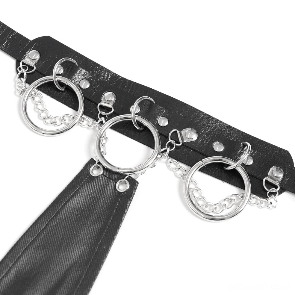 Flat lay close-up of choker hardware showing metal rings, studded leather components, and chain connectors