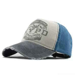 Gray and blue washed cotton vintage baseball cap with NYPD graphic, color-blocked gothic aesthetic
