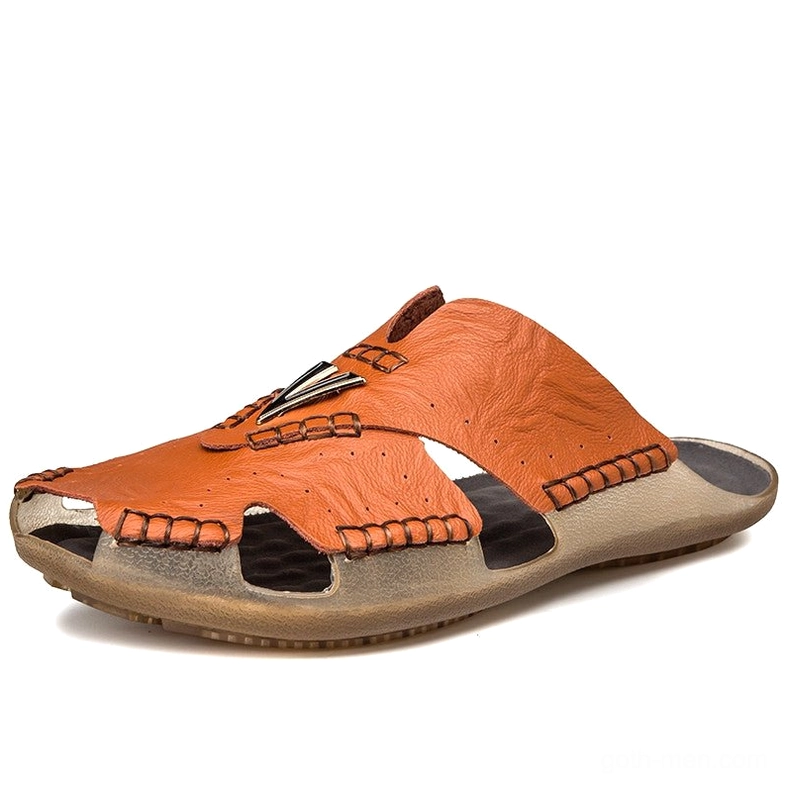Orange-brown gothic men's leather sandal with decorative metal hardware and perforated cutout details