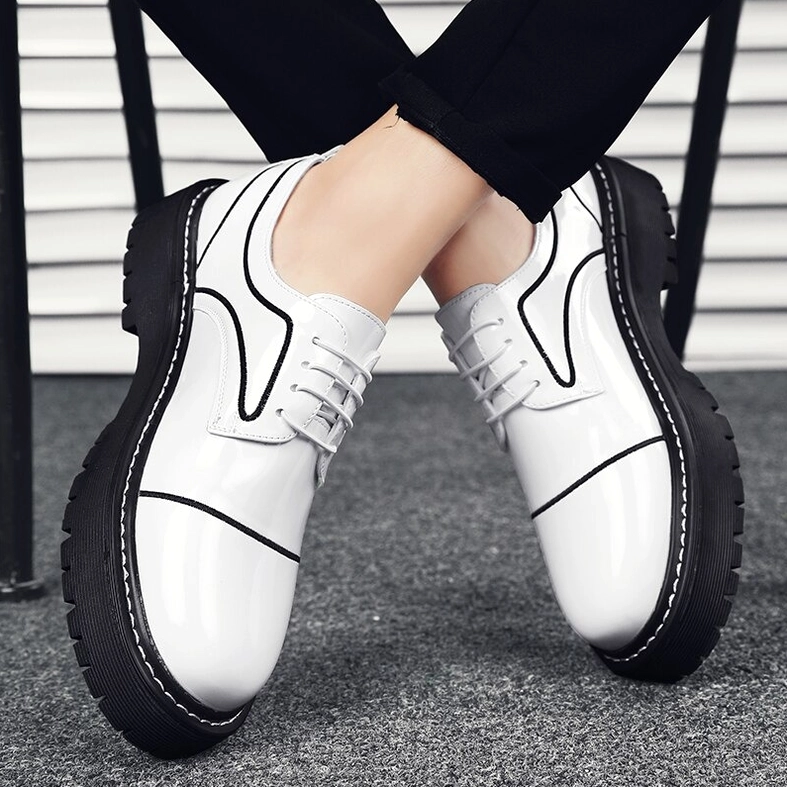 Pair of men's gothic oxford platform shoes architectural lace-up construction overhead view