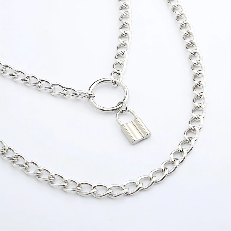 Silver curb chain gothic necklace with padlock pendant, macro close-up revealing link quality and metal finish on layered chain