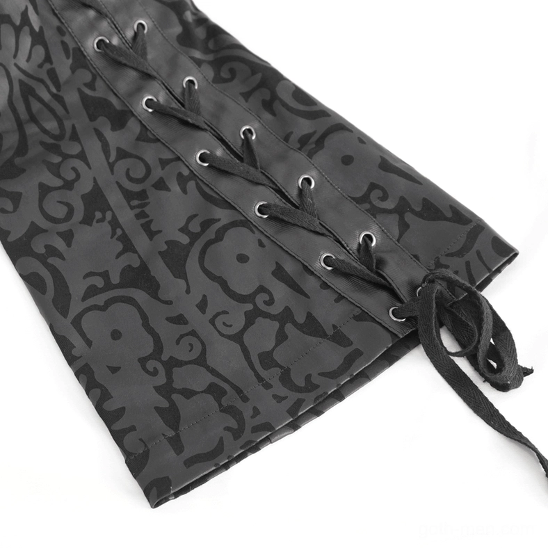 Ankle drawstring fasteners on flared hem of black gothic trousers close-up