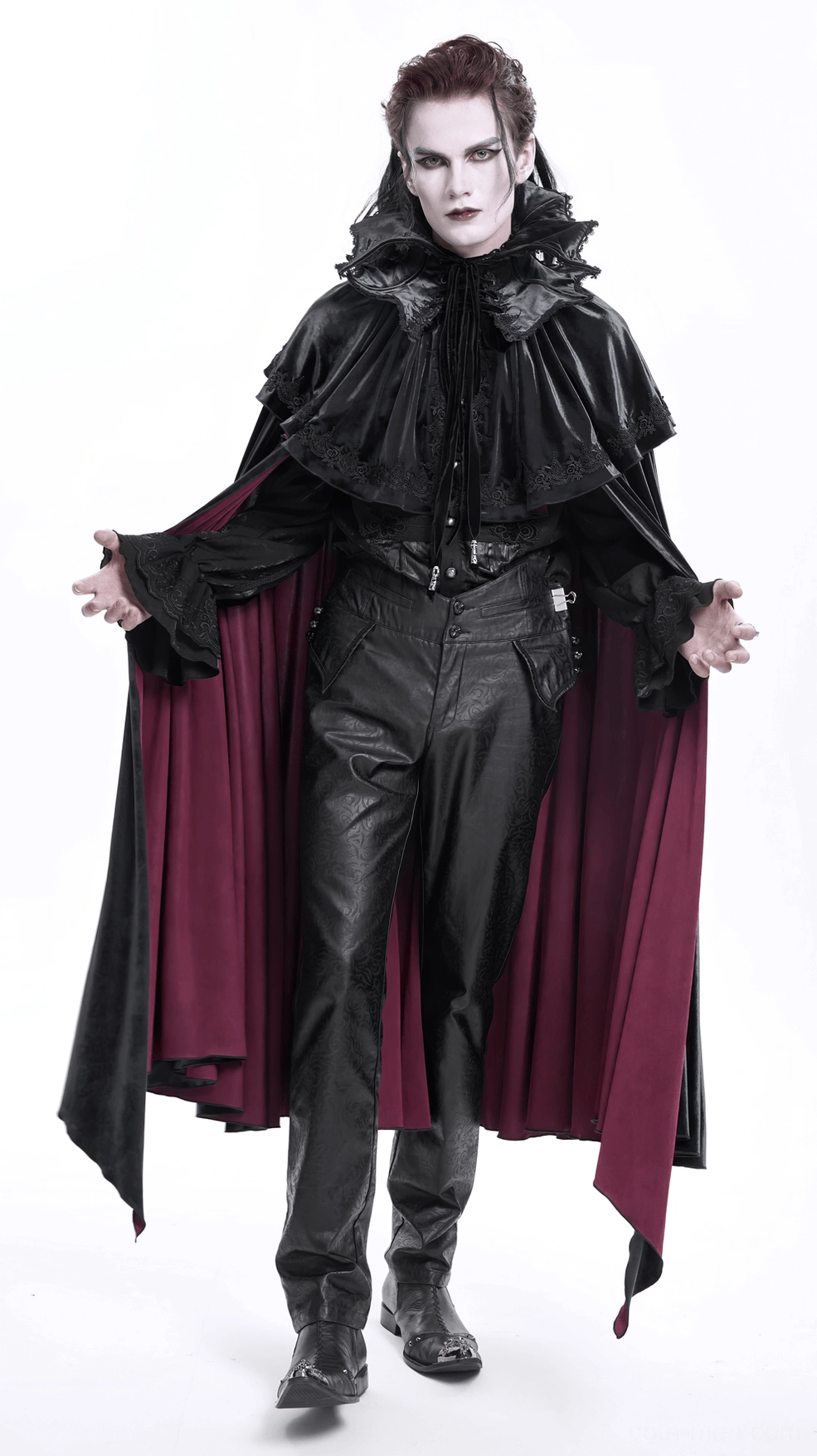 Front lower leg and ankle view of black embossed gothic pants, highlighting straight cut design and premium finish