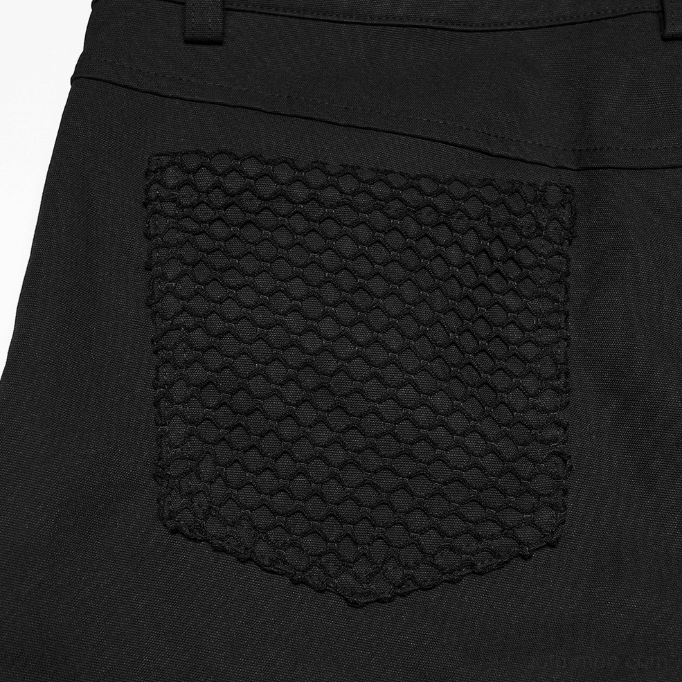 Back pocket close-up of black gothic mesh pants showing honeycomb texture reinforcement