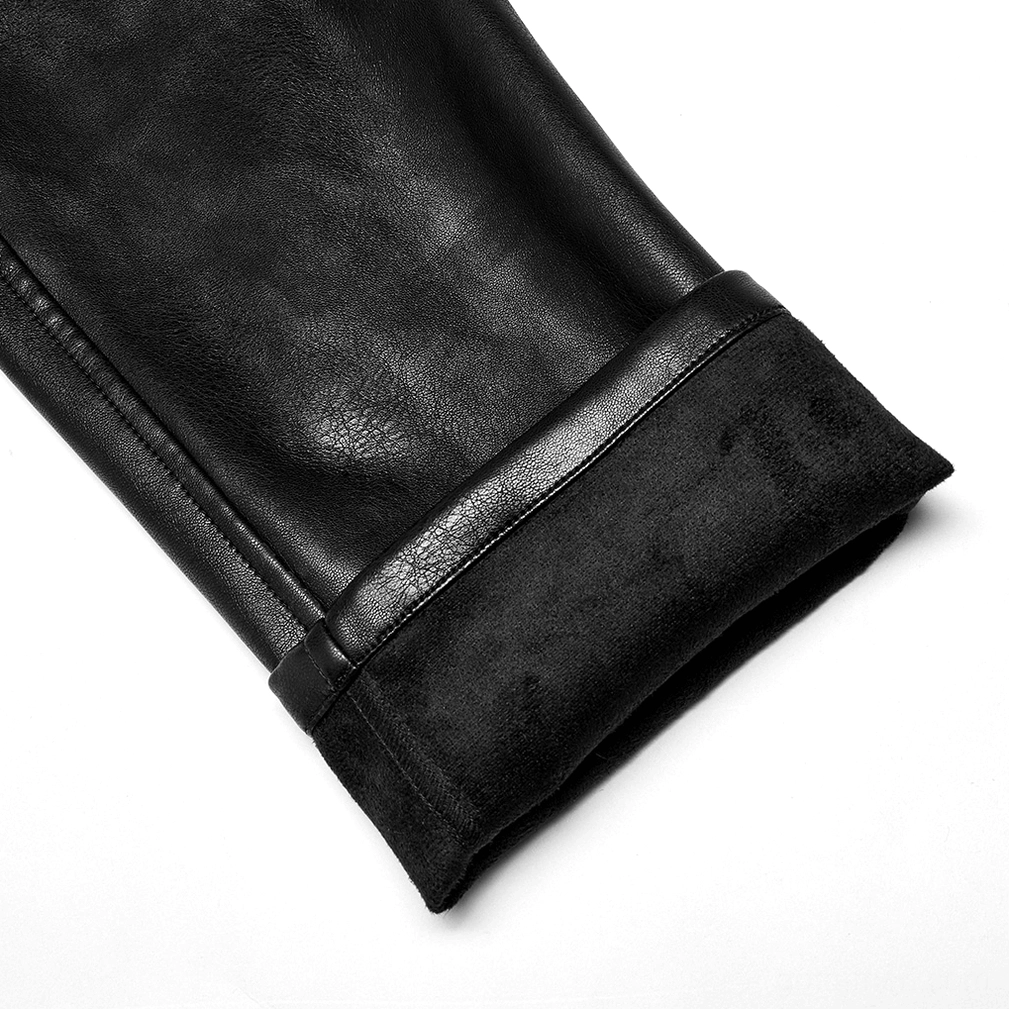 Close-up of black gothic leather pants cuff hem showing reinforced strap trim detail