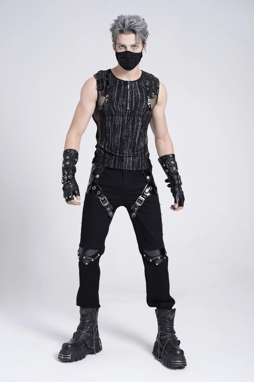 Studded gothic pants close-up showing textile blend and patent leather construction quality