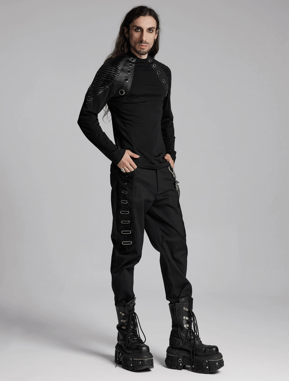 Textured fabric detail of black twill and PU leather accent panels on alternative gothic pants