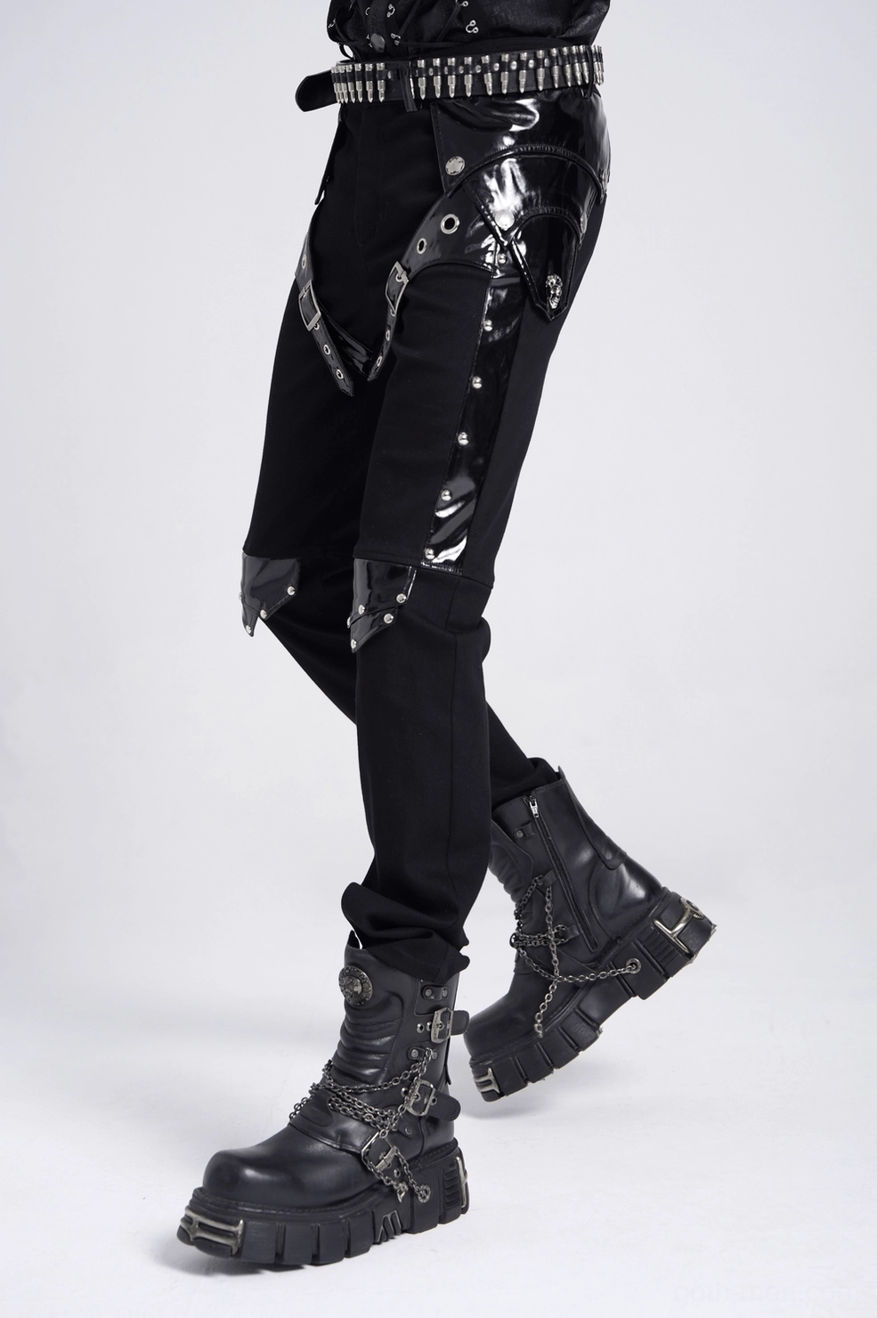 Black gothic leather pants highlighting fitted cut and metal embellishments on model