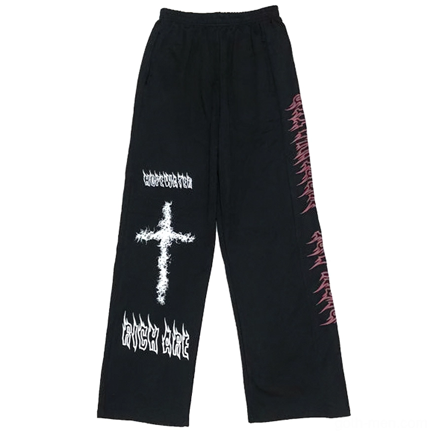 Black gothic wide leg pants flat lay showing elastic waist and white graffiti print detail