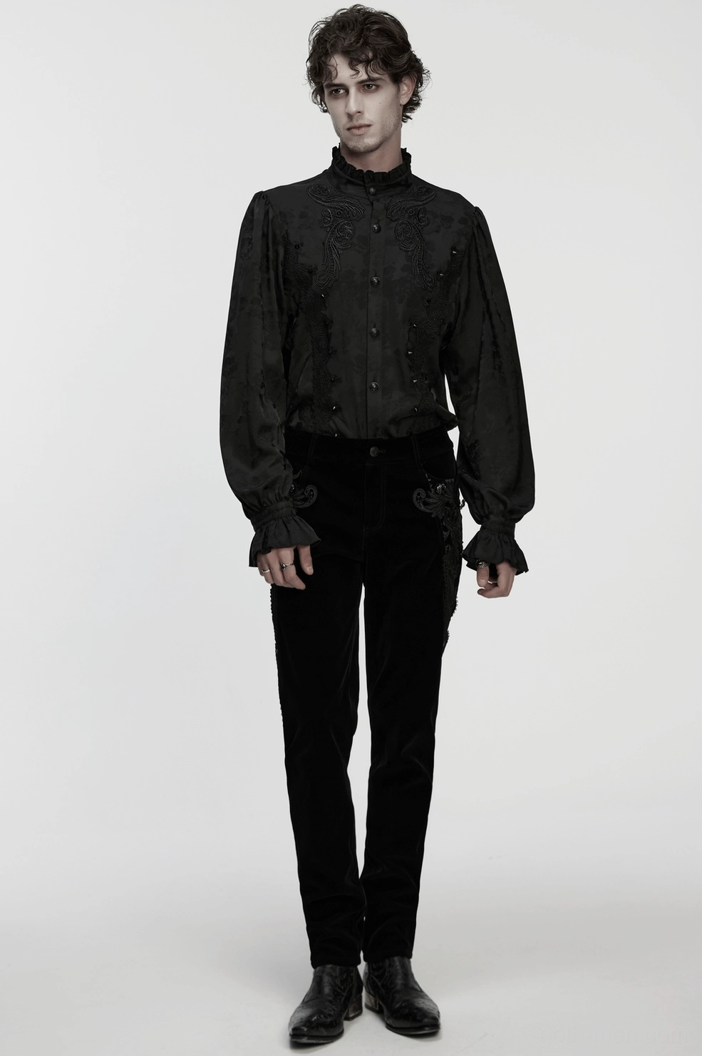 Black velvet gothic pants detail shot highlighting gemstone buttons and ornamental side panel design