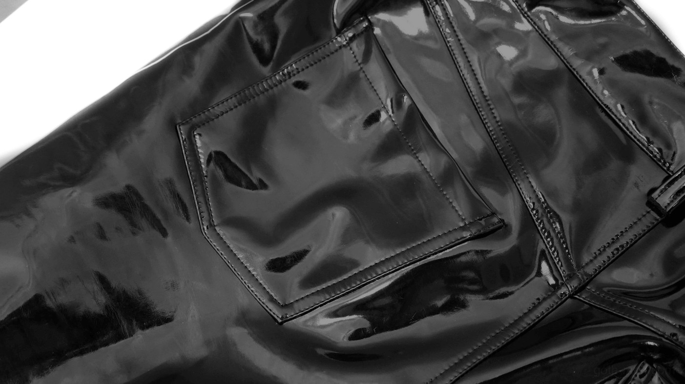 Glossy black patent leather pants highlighting sheen finish and slim fit silhouette