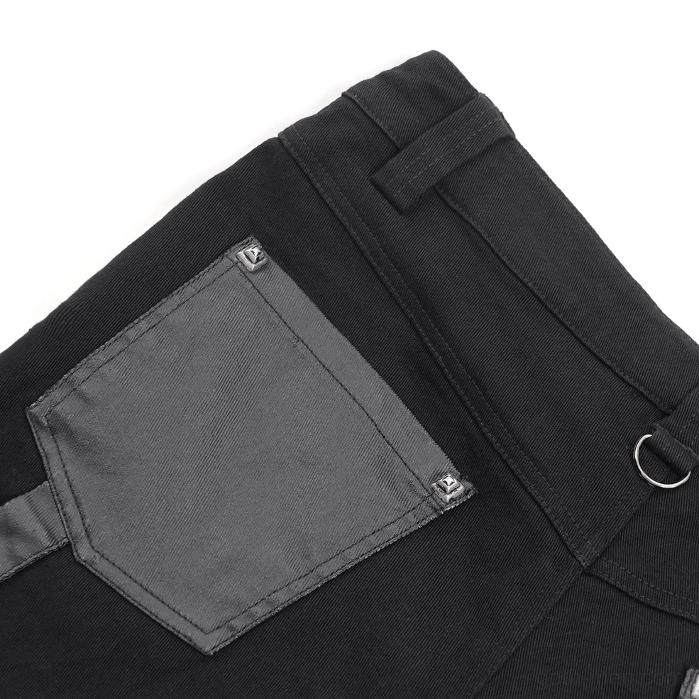 Black gothic slim-fit pants hem and leg opening detail showing frayed edges and construction