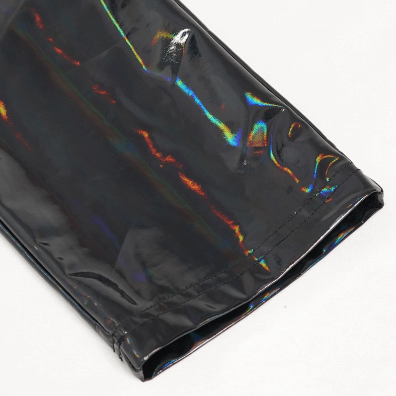 Black patent leather pants leg cuff detail - close-up of glossy iridescent hem and slim fit silhouette