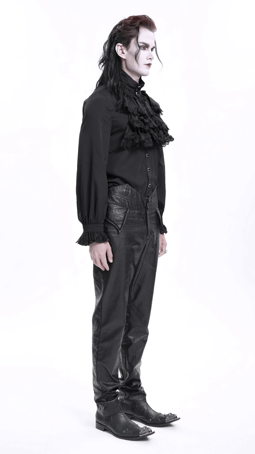 Close-up of black synthetic leather gothic pants leg opening cuff, showing finished hem and embossed texture detail