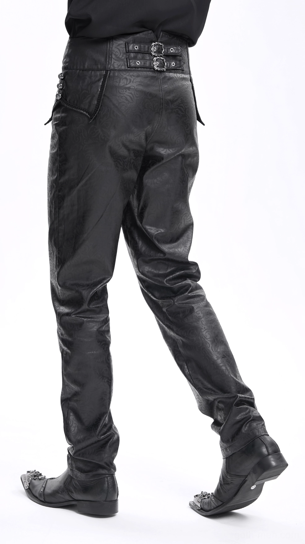Detailed shot showing leg seam and fit of black embossed gothic pants, demonstrating slim tailoring through thigh and calf
