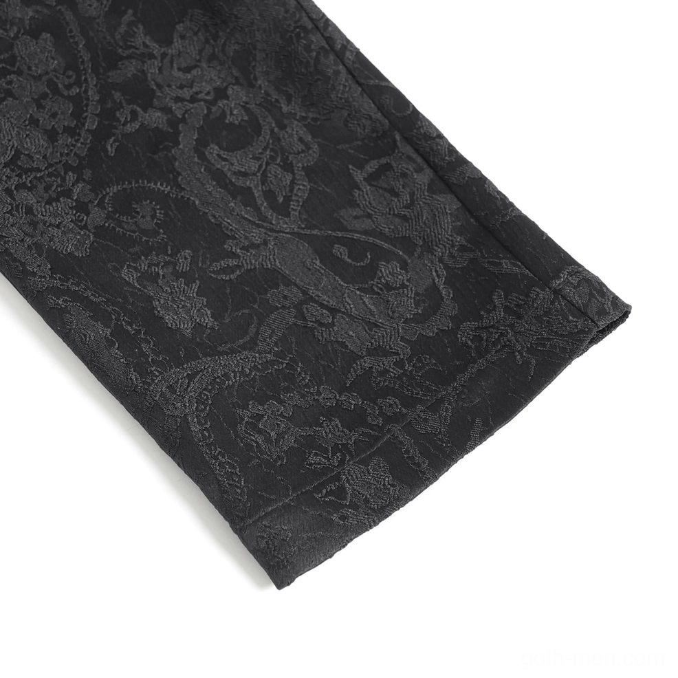 Close-up of gothic cargo pants showing ornate silver metal buckle and black velvet strap hardware