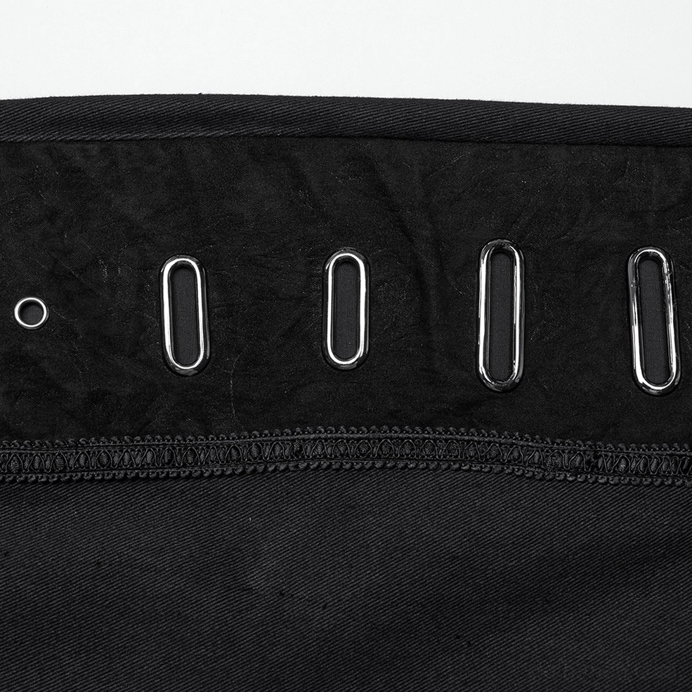 Macro photography of metal oval eyelets and reinforced stitching on gothic pants waist area