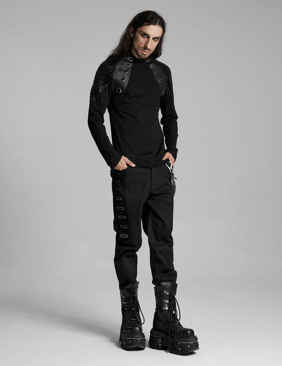 Reinforced topstitching and patch pocket construction on black gothic twill trousers - detail shot