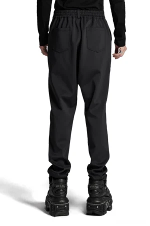 Dark rivet pants with 3D pocket details - rear full length view showcasing back patch pockets and elastic waistband