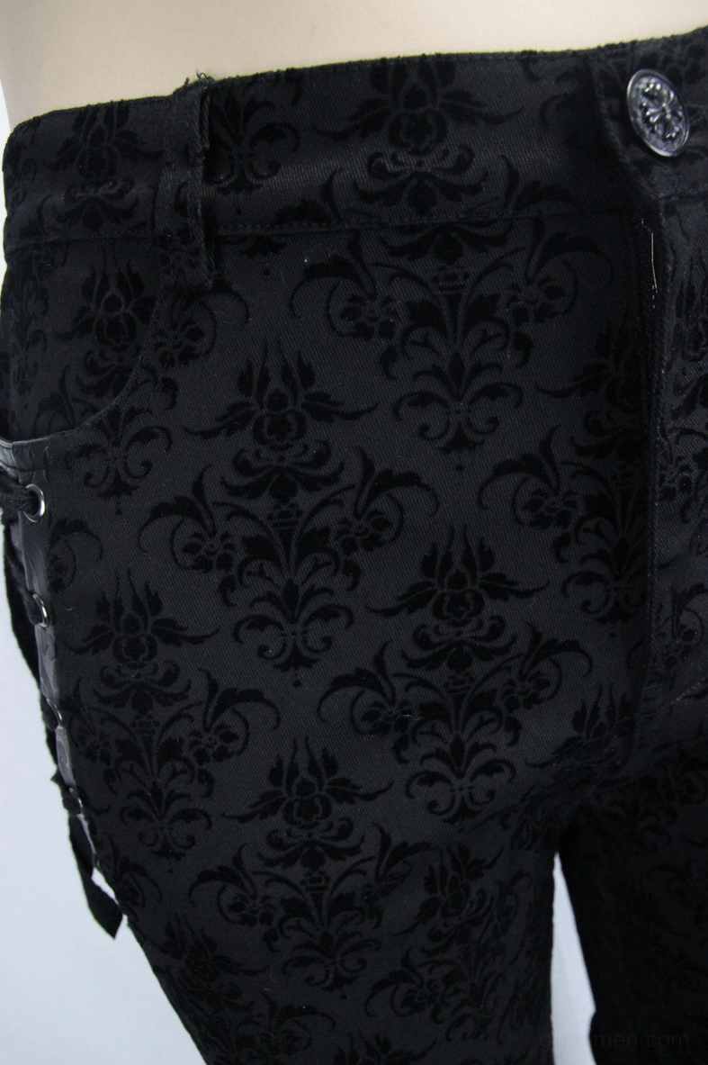 Rear hip pocket area close-up of gothic black trousers with damask pattern and decorative button details