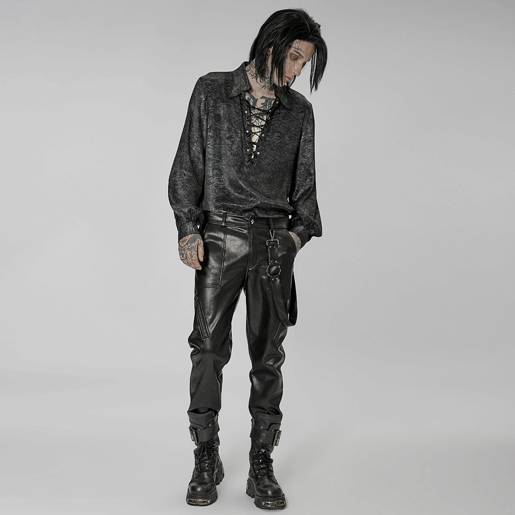 Black gothic leather pants construction detail with metal rivets and precision hardware finishing