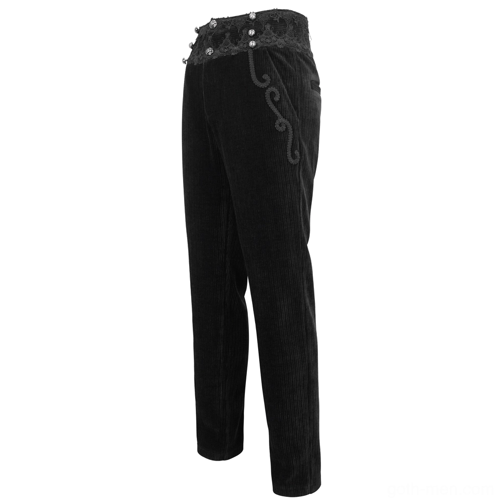 Side three-quarter view of black gothic corduroy pants highlighting scroll embroidery detail
