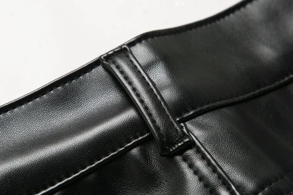 Side waistband showing reinforced belt loops and topstitching on black PU leather pants