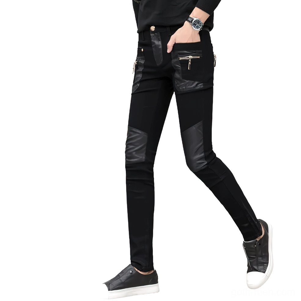 Men's black gothic slim pants side walking view showing zipper decorations and leather patches movement