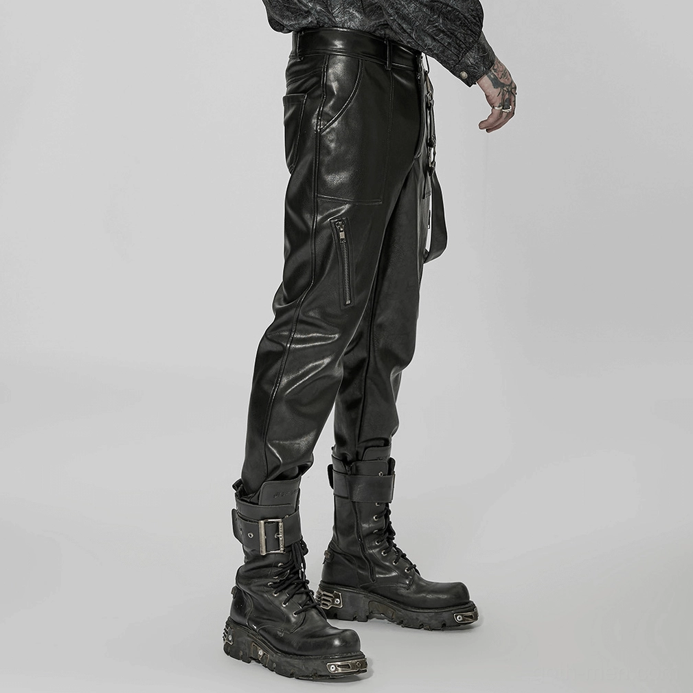 Black gothic leather pants detail shot showing strap attachment points and industrial aesthetic