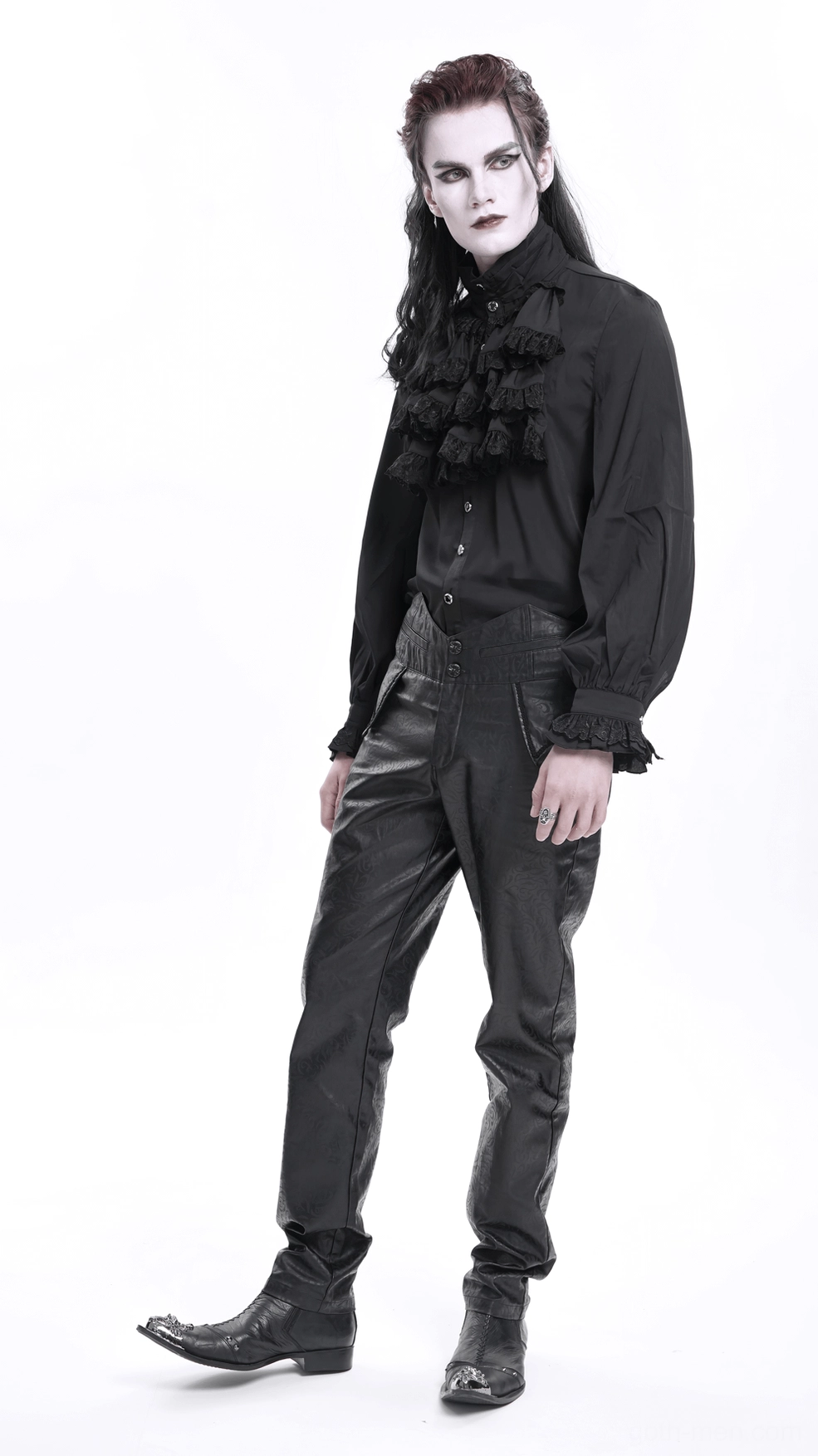 Upper thigh detail of black gothic synthetic leather pants, showing embossed damask pattern and premium material quality