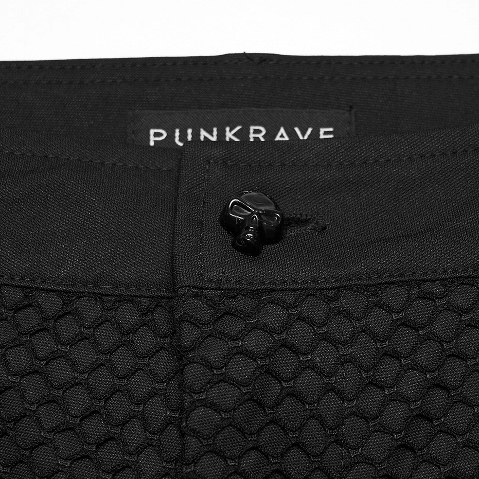 Black gothic pants button closure and PUNKRAVE tag detail - top view