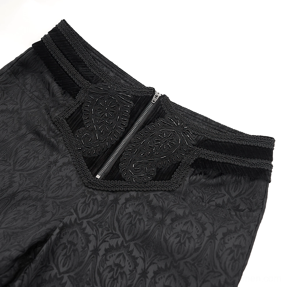 Gothic pants waist detail close-up, showing front zipper mechanism, paisley embroidery accents, and luxurious velvet trim on waistband
