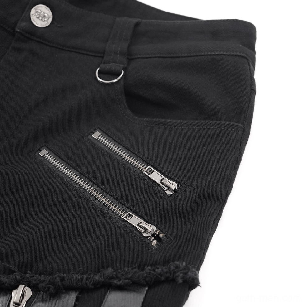 Close-up of black gothic slim-fit pants zippered pocket showing metal zipper and frayed hem details