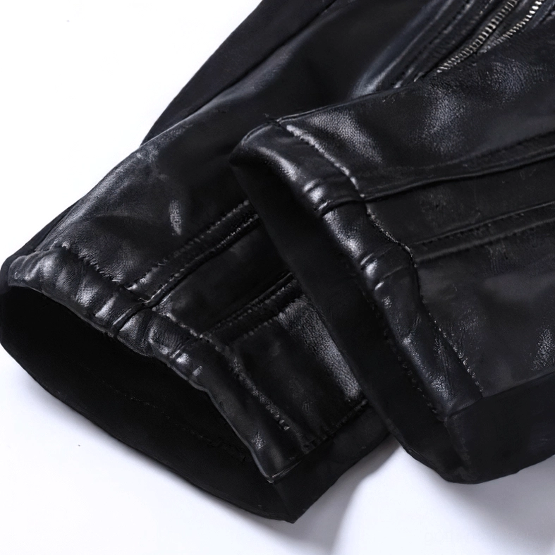 Dynamic styling view of black patchwork gothic biker pants - slim fit male trousers with faux leather accents and punk edge