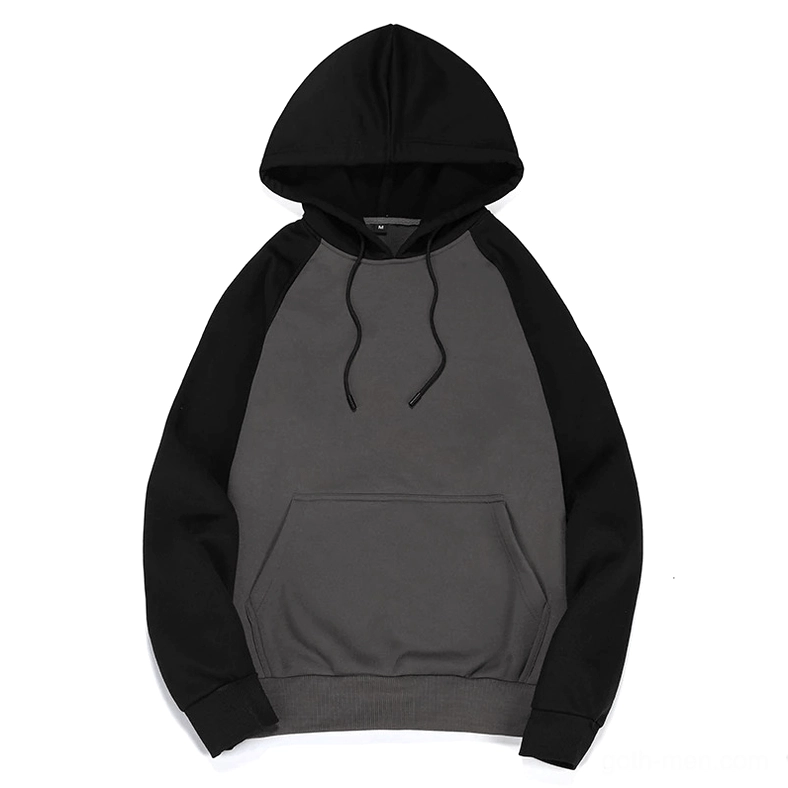 Black and dark gray patchwork hoodie flat lay showing drawstring hood and fleece texture