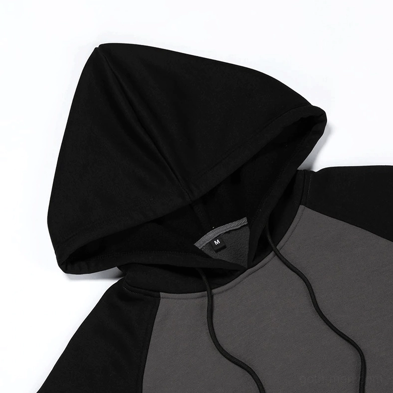 Drawstring hood adjustment detail on color-block fleece hoodie