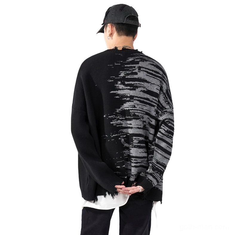 Back view of gothic oversized sweater featuring matching abstract print pattern and distressed frayed hem