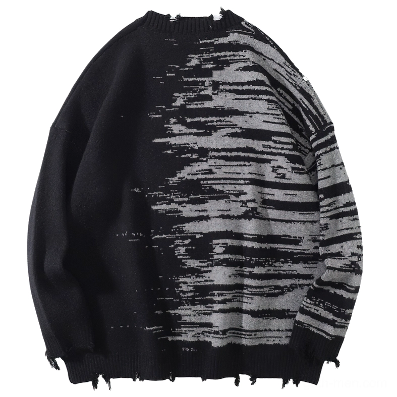 Flat lay back view of gothic sweater displaying consistent patterning and deliberately frayed hemline details