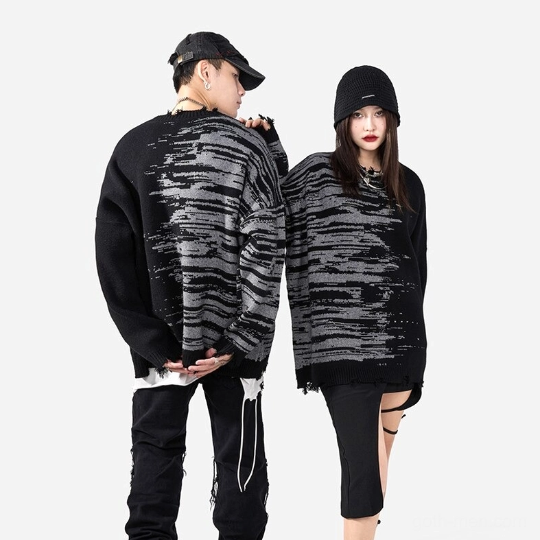 Full body front view of black gothic patchwork distressed sweater on male model in white studio setting
