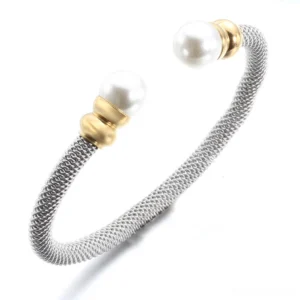 Open cuff gothic pearl bracelet showing braided silver metal and white pearls - side oblique angle