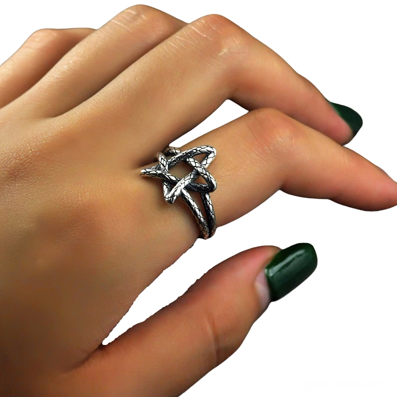 Pentagram ring worn on hand close-up dark aesthetic alternative jewelry