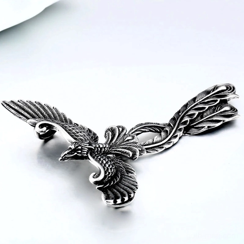 Phoenix pendant charm with 3D open wing design, side profile showing engraved feather details, stainless steel