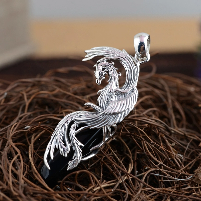 Gothic phoenix obsidian pendant three-quarter view, featuring intricate feather carving and head details of the bird design