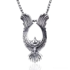 Gothic phoenix stainless steel pendant flat lay with intricate feather carving details on white background
