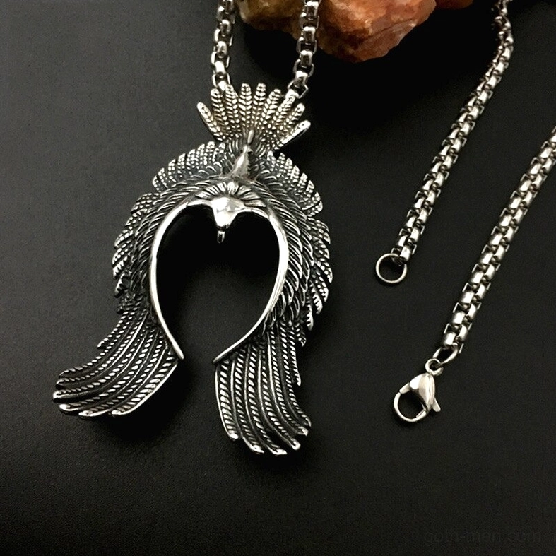 Stainless steel gothic phoenix pendant reflecting light on black background showing hollow carved design