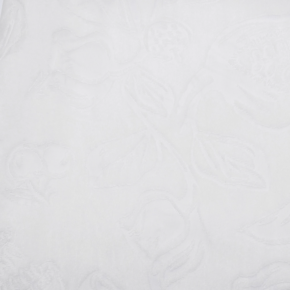 Close-up texture of white sheer mesh and embossed floral velvet piranha pattern