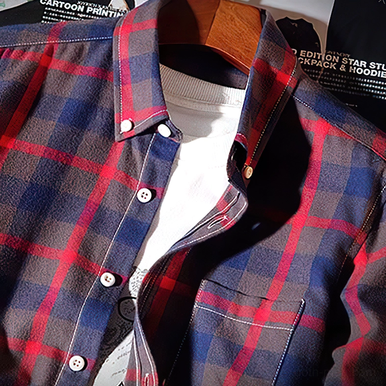 Close-up detail of gothic plaid shirt button-down collar and woven tartan fabric texture